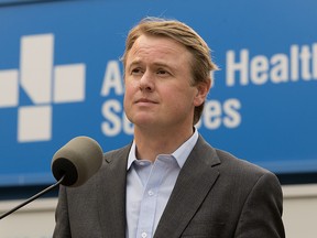 Alberta Health Minister Tyler Shandro answers media questions about the Province's COVID-19 response outside the University of Alberta Hospital, in Edmonton Thursday July 29, 2021. Sandro was taking part in a press conference where the Province announced $1 million to explore a possible stand-alone Stollery Children's Hospital. Photo by David Bloom