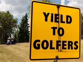 A golfer drives a cart while playing a round at Rundle Park Golf Course in Edmonton, on Wednesday, July 7, 2021. Council is asking for expressions of interest from contractors to take over operations at three city-owned public courses.