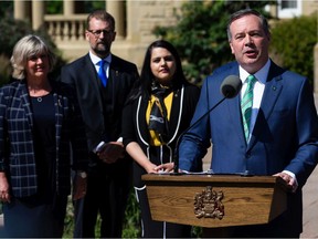 Premier Jason Kenney speaks alongside new cabinet members after a swearing in ceremony at Government House in Edmonton on Thursday, July 8, 2021. Government ministers and associate ministers were sworn in as part of a cabinet shuffle.