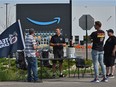 Teamsters Local 362 and supporters outside the Amazon Warehouse, talking to workers informing them about unions in south Edmonton, July 14, 2021. Ed Kaiser/Postmedia