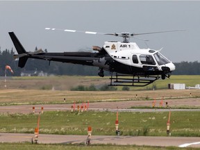 An Edmonton Police Service helicopter lands at Villeneuve Airport in Sturgeon County on July 22, 2021.