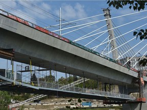 The pedestrian crossing underneath the Tawatinâ LRT Bridge is still being worked on after initially expected to be completed in 2019. TransEd says the bridge will be open closer to service commencement by the end of the year.