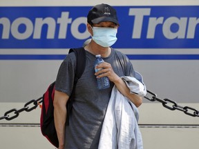 A man is seen wearing a face mask in Edmonton, Thursday, July 29, 2021.