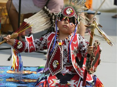 Ronnie O'Chiese, 9, tries to keep cool at the annual Edmonton Heritage Festival held at Hawrelak Park in Edmonton on Saturday, July 31, 2021.