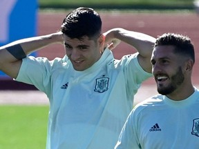 Spain's forward Alvaro Morata (L) and Spain's midfielder Koke (R) attend Spain's training session at the Ciudad del Futbol in Las Rozas near Madrid on Monday.