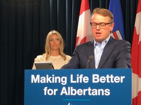 Jessica Janzen Olstad (left), executive director of the Love for Lewiston Foundation, with Health Minister Tyler Shandro at an announcement for newborn screening for spinal muscular atrophy Wednesday, July 21, 2021.