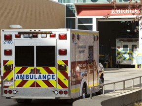 Alberta Health Services ambulances line up outside of the Royal Alexandria Hospital in Edmonton on Oct. 16, 2014. The province announced new locations for paramedics to drop off patients in Alberta on Tuesday, July 6, 2021, in an effort to reduce the strain on emergency medical services.