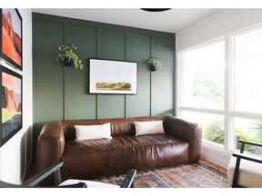 Sherwin-Williams Rosemary SW 6187 provides a calming green background to this living room.