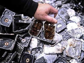 Vials with magnets containing rare earth elements after extraction from electronic waste in Orleans, central France.