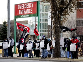 Health-care workers stage a wildcat strike at University of Alberta Hospital on Oct. 26, 2020, to protest job cuts announced by the Alberta government.