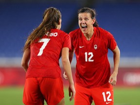 Christine Sinclair of Team Canada celebrates with Julia Grosso (left) following their team's victory in the penalty shoot out in the Women's Gold Medal Match between Canada and Sweden on day 14 of the Tokyo 2020 Olympic Games at International Stadium Yokohama on Friday in Yokohama, Kanagawa, Japan.