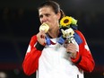 Gold medalist Christine Sinclair of Team Canada poses with their gold medal during the Women's Football Competition Medal Ceremony at the Tokyo 2020 Olympic Games at International Stadium Yokohama on August 06, 2021 in Yokohama, Kanagawa, Japan.