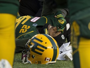 Edmonton kick returner Christion Jones (22) is helped on the field after being injured against the Saskatchewan Roughriders at Commonwealth Stadium in Edmonton on Oct. 26, 2019.