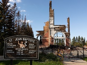 The fire-damaged remnants of St. Jean Baptiste Church are seen in Morinville, north of Edmonton, on Wednesday, Aug. 25, 2021. The church burned down on June 30 and the fire is under investigation. Photo by Ian Kucerak