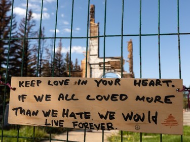 A note about strength of the church community is seen on a fence at the site of St. Jean Baptiste Church in Morinville, north of Edmonton, on Wednesday, Aug. 25, 2021. The church burned down on June 30 and the fire is under investigation. Photo by Ian Kucerak