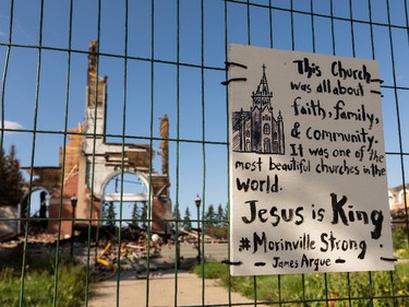 A note about strength of the church community is seen on a fence at the site of St. Jean Baptiste Church in Morinville, north of Edmonton, on Wednesday, Aug. 25, 2021. The church burned down on June 30 and the fire is under investigation. Photo by Ian Kucerak