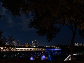 The High Level Bridge is lit gold, blue and white to honour the Edmonton Stingers, repeat Canadian Elite Basketball League champions, in Edmonton, on Monday, Aug. 30, 2021. The team beat the Niagara River Lions to take the title on Aug. 23. Photo by Ian Kucerak