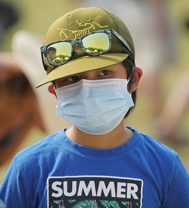 A boy enjoys the summer festivities at the Edmonton Heritage Festival in Hawrelak Park on Saturday July 31, 2021.