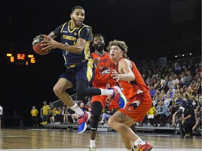 Edmonton Stingers Xavier Moon drives to the basket against the Fraser Valley Bandits on Aug. 6, 2021 in Edmonton.