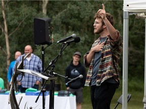 Alliance White, Robert White's younger son, gives a eulogy in memory of his father during a celebration of life held for the artist, family man and friend at Buena Vista Park in Edmonton, on Sunday, Aug. 8, 2021. Photo by Ian Kucerak