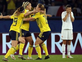 Swedish players celebrate at the end of the France 2019 Women's World Cup Round of 16 football match between Sweden and Canada, on June 24, 2019, at the Parc des Princes stadium in Paris.