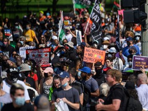 Protesters rally to demand protection for voting rights on the 58th anniversary of the 1963 March on Washington for Jobs and Freedom, in Washington, DC, on Aug. 28.
