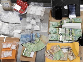 Edmonton police seized more than $117,000 in cash and drugs on Friday, Aug. 20, 2021, in Edmonton.