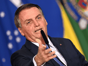 Critics say Jair Bolsonaro, like former U.S. president Donald Trump, is sowing doubts in case he loses the 2022 election.