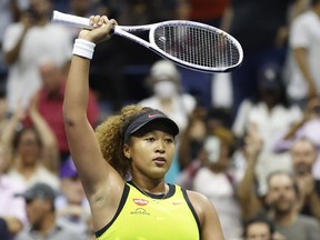Naomi Osaka of Japan celebrates after recording match point Marie Bouzkova of Czech Republic in the first round on day one of the 2021 U.S. Open tennis tournament at USTA Billie King National Tennis Center in Flushing, N.Y., Aug. 30, 2021.
