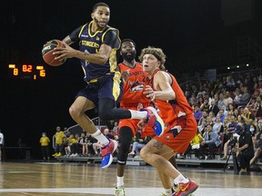 Edmonton Stingers guard Xavier Moon drives to the basket against the Fraser Valley Bandits on Friday, Aug. 6, 2021 in Edmonton.