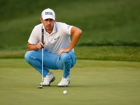 Aug 29, 2021; Owings Mills, Maryland, USA; Patrick Cantlay lines up a putt on the third playoff hole during the final round of the BMW Championship golf tournament.