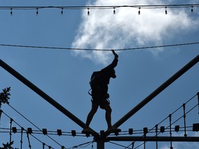A person using his acrobatic skill climbing on the treehouse jungle gym like aerial maze at the Snow Valley Aerial Park in Edmonton, August 24, 2021. Ed Kaiser/Postmedia