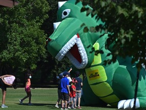 Young golfing students watch as Godzilla is blownup to be used as target practice at Victoria Golf Course in Edmonton, August 26, 2021. Ed Kaiser/Postmedia