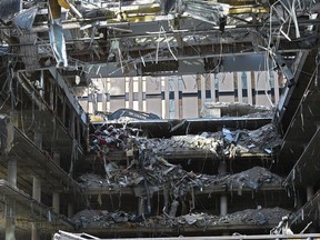 The old Bank of Montreal building being demolished from the inside out to make way for a future high-rise building along 101 St. in downtown Edmonton, February 19, 2018. File photo.