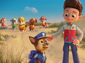 Ryder, the human voiced by Will Brisbin, with his puppy cohorts in Paw Patrol: The Movie, opening Friday, Aug. 20.