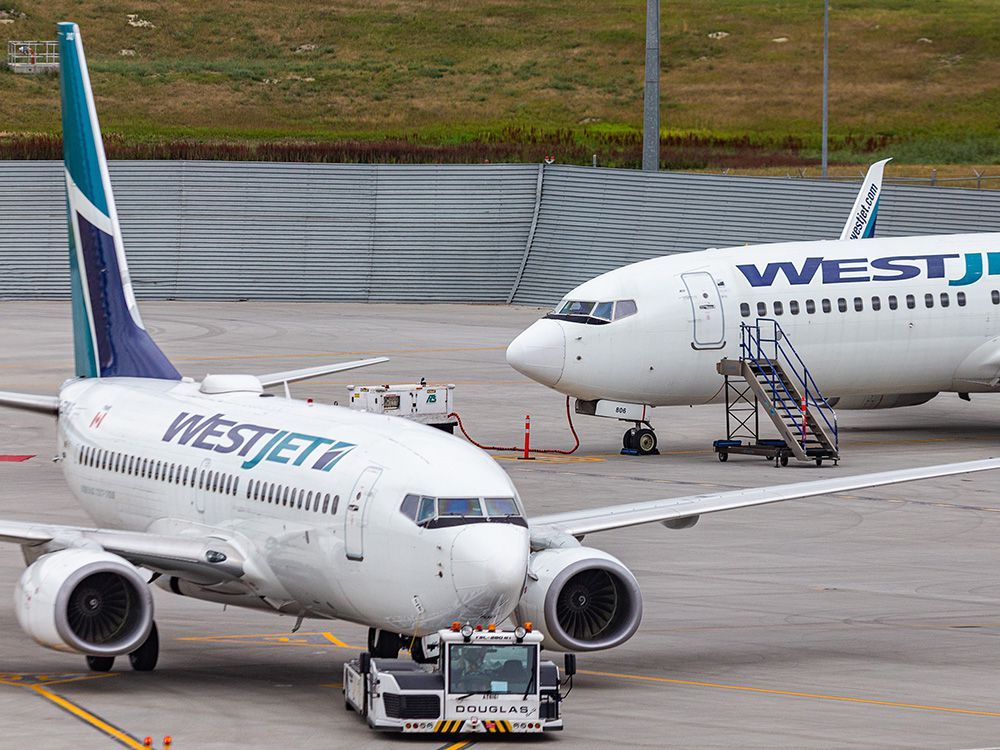  WestJet planes at Calgary International Airport on Tuesday, Aug. 10, 2021.