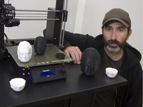 aAron Munson will be 3D printing thousands of Buddha heads as he meditates over the next month. Fish Griwkowsky photo