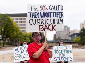 Demonstrators protested the draft Alberta curriculum at the Alberta legislature in Edmonton, on Saturday, Sept. 11, 2021.