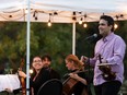 The Vaughan String Quartet, comprised of Vladimir Rufino (speaking) on violin, Mattia Berrini (in back) on violin, Fabiola Amorim (left) on viola and Silvia Buttiglione (back right) on cello, perform an outdoor concert at Festival Place in Sherwood Park on Sept. 24.