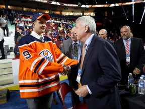 Ilya Konovalov shakes hands with Oilers CEO Bob Nicholson being selected 85th overall by the Edmonton Oilers during the 2019 NHL Draft at Rogers Arena on June 22, 2019.