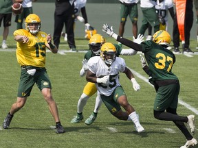 Taylor Cornelius (15), Vontae Diggs (13), Walter Fletcher (25) and Caleb Ham (37) take part in Edmonton Elks training camp at Commonwealth Stadium, Tuesday July 27, 2021.