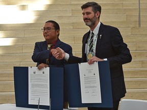 Mayor Don Iveson, right, and Grand Chief Okimaw Vernon Watchmaker during a signing ceremony for a memorandum of cooperation and dialogue at Edmonton City Hall on Wednesday, Sept. 15, 2021.