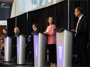 Mayoral candidates (left to right) Rick Comrie, Kim Krushell, Michael Oshry, and Cheryll Watson and Amarjeet Sohi are seen on stage during the Downtown Business Association's The Future of Downtown Mayoral Forum in Ford Hall at Rogers Place in Edmonton, on Thursday, Sept. 23, 2021. Candidate Mike Nickel was invited but didn't appear.