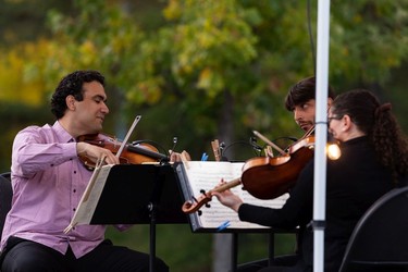 The Vaughan String Quartet, comprised of Vladimir Rufino on violin, Mattia Berrini on violin, Fabiola Amorim on viola and Silvia Buttiglione on cello (not shown), perform an outdoor concert at Festival Place in Sherwood Park, on Friday, Sept. 24, 2021.