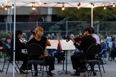 The Vaughan String Quartet, (left to right) Fabiola Amorim on viola, Silvia Buttiglione on cello, Mattia Berrini on violin and Vladimir Rufino on violin, perform an outdoor concert at Festival Place in Sherwood Park, on Friday, Sept. 24, 2021.
