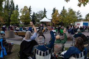 The crowd raise their hands if they've heard string quartets before as the Vaughan String Quartet, comprised of Vladimir Rufino on violin, Mattia Berrini on violin, Fabiola Amorim on viola and Silvia Buttiglione on cello, perform an outdoor concert at Festival Place in Sherwood Park, on Friday, Sept. 24, 2021.