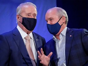 Canada's opposition Conservative party leader Erin O'Toole speaks to Former Canadian Prime Minister Brian Mulroney during O'Toole's election campaign tour in Orford, Quebec, Canada September 15, 2021.