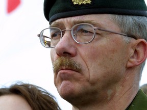Four Canadian soldiers from Edmonton Garrison were killed in Afghanistan by "friendly fire. " Brig. Gen. Ivan Fenton of Edmonton Garrison speaks at a media conference in Edmonton on April 18, 2002, as a Canadian flag flies at half staff in the background.