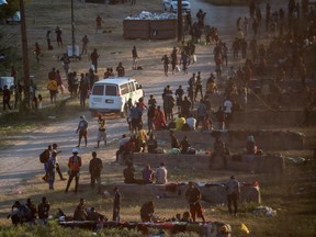 Migrants seeking asylum in the U.S. rest near the International Bridge in Del Rio, TX, on Sept. 16.