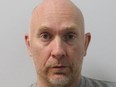 An undated handout picture released by the Metropolitan Police on July 9, 2021, shows British police officer Wayne Couzens, 48, who pleaded guilty to the murder of Sarah Everard, via video link at London's Old Bailey court.